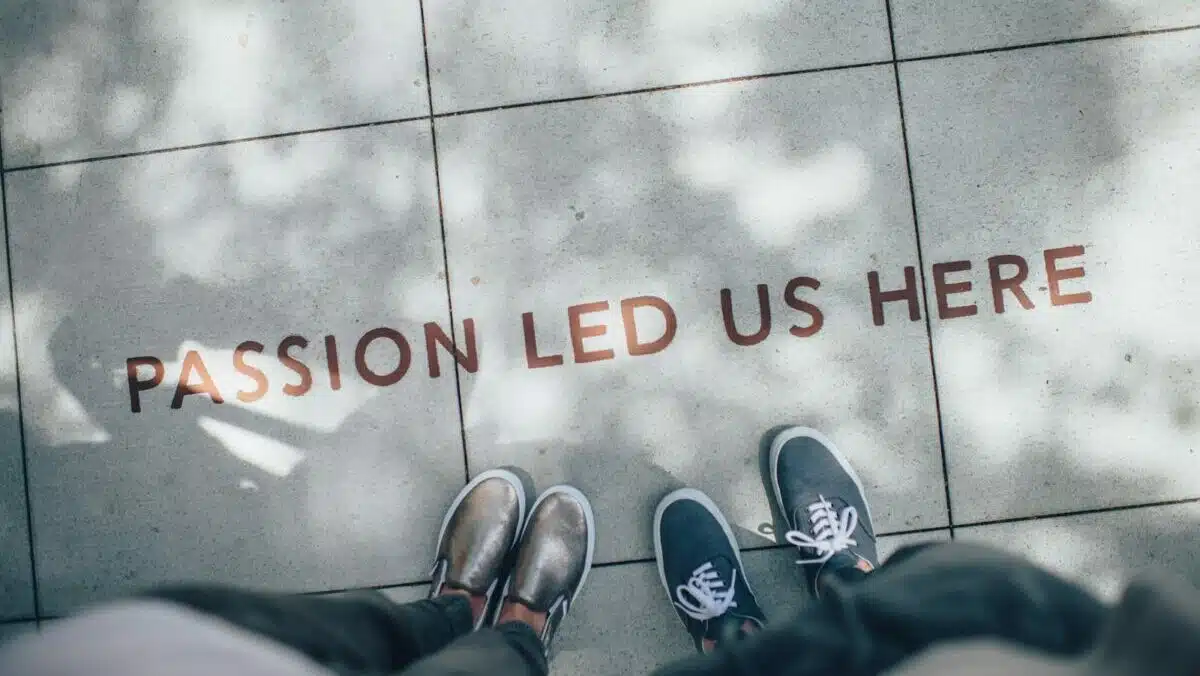 two person standing on gray tile paving